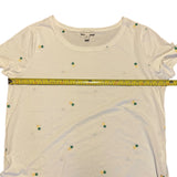 Pit to pit of white pineapple shirt