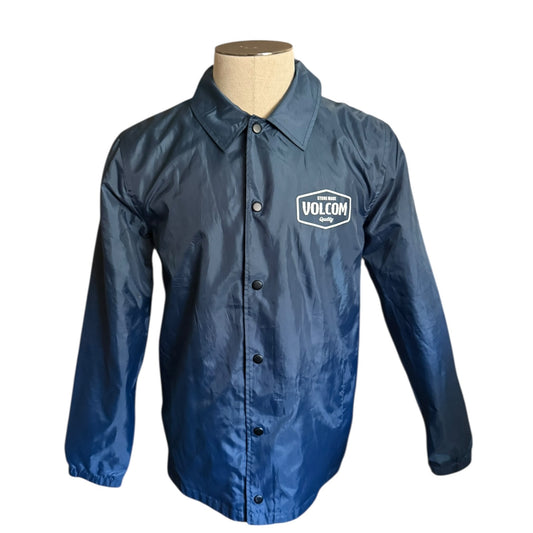 Blue jacket with Volcom logo on a mannequin against a white background