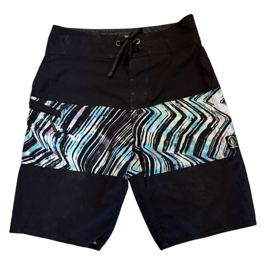 Black board shorts with a colorful pattern on a white background