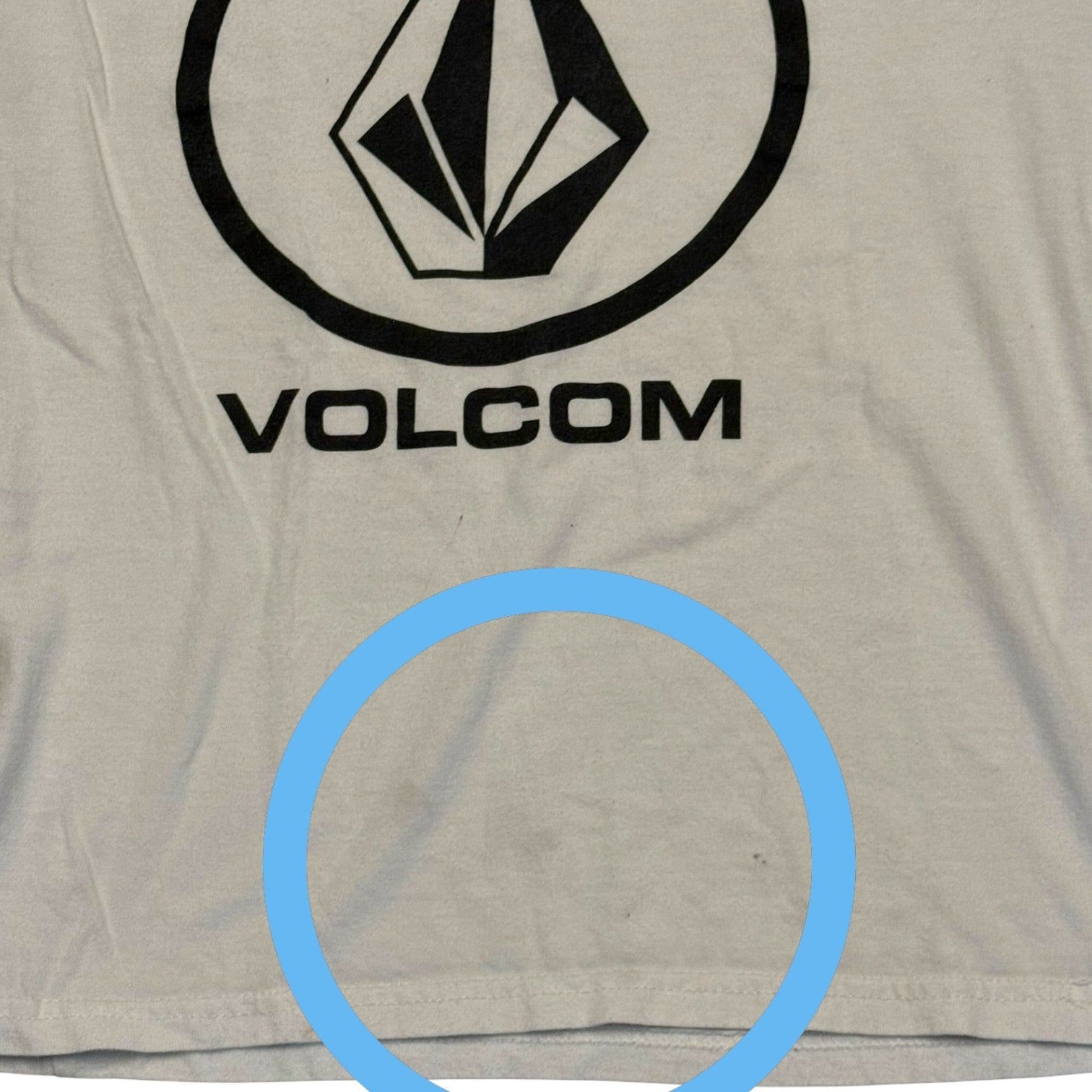 White t-shirt with Volcom logo showing issues
