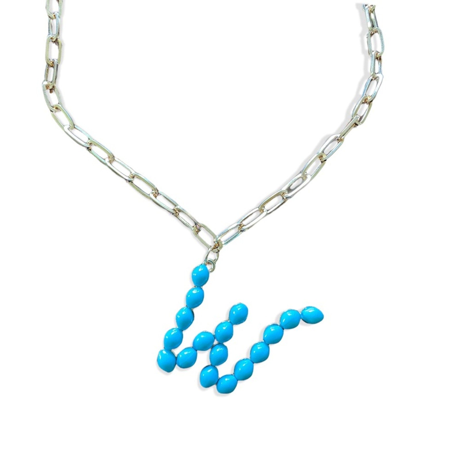 A gold color chain necklace featuring a pendant made of bright turquoise blue beads arranged in a W, shown on a plain white background.