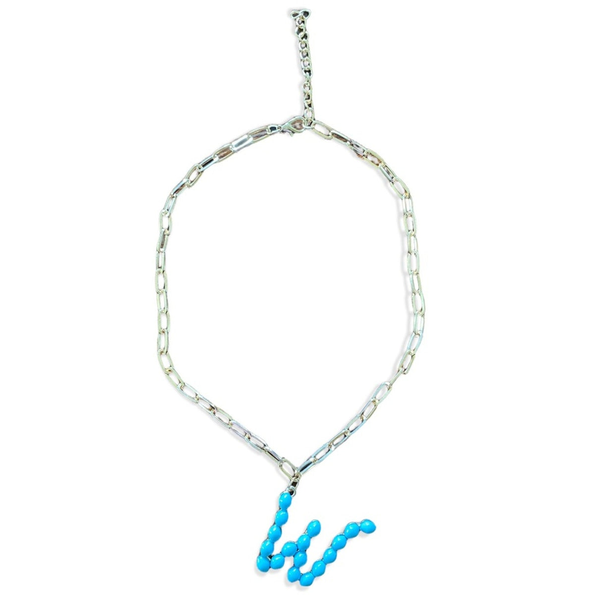 A gold-toned chain necklace featuring a wavy, segmented turquoise blue bead pendant, displayed against a solid white background.