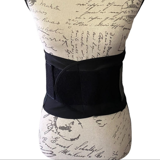 Black waist support belt on a mannequin with a vintage-style background