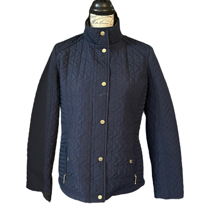 Front of Navy quilted jacket with  buttons on a white background