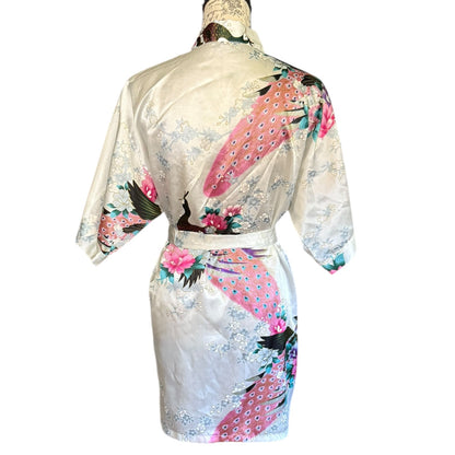 Back of satin white robe with floral and bird patterns on a white background