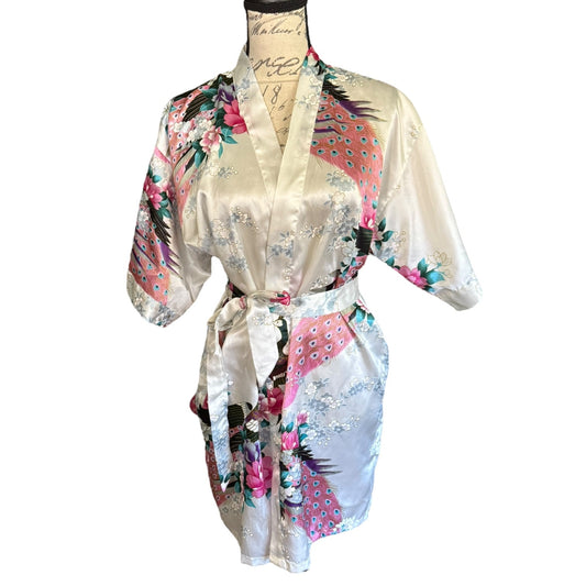 Floral and peacock print satin robe on a mannequin against a white background