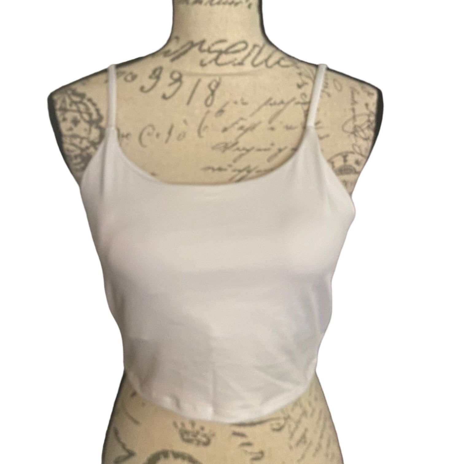 White tank bra front on a mannequin with a white background