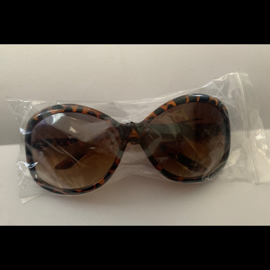 Sunglasses in clear plastic packaging on a white background