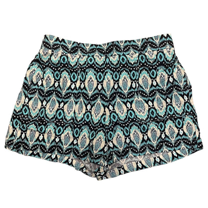 A pair of women's shorts featuring an all-over geometric and paisley-style displayed flat against a solid white background.