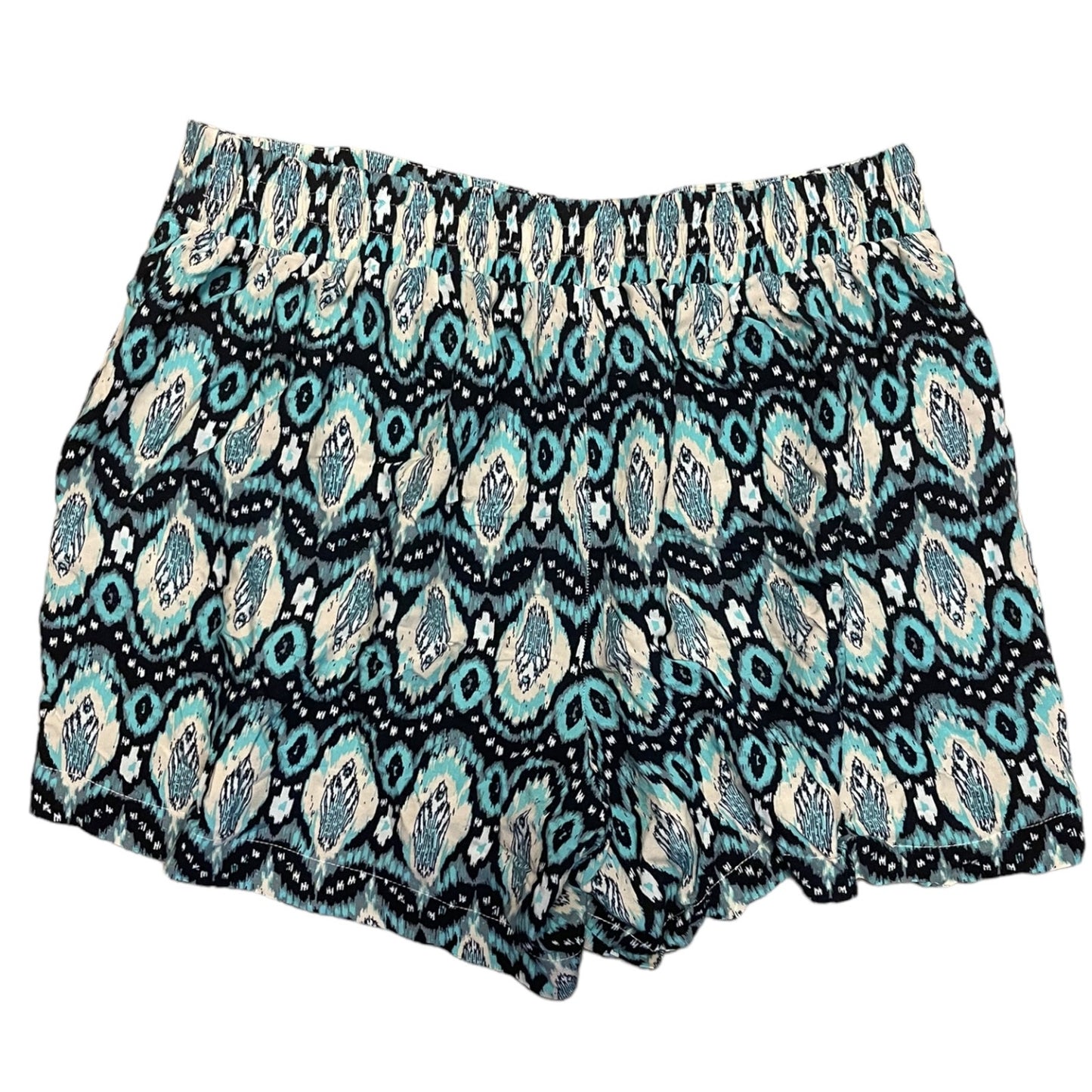 A pair of women's shorts featuring an all-over geometric ikat pattern in blue, black, and cream, displayed flat against a solid white background.
