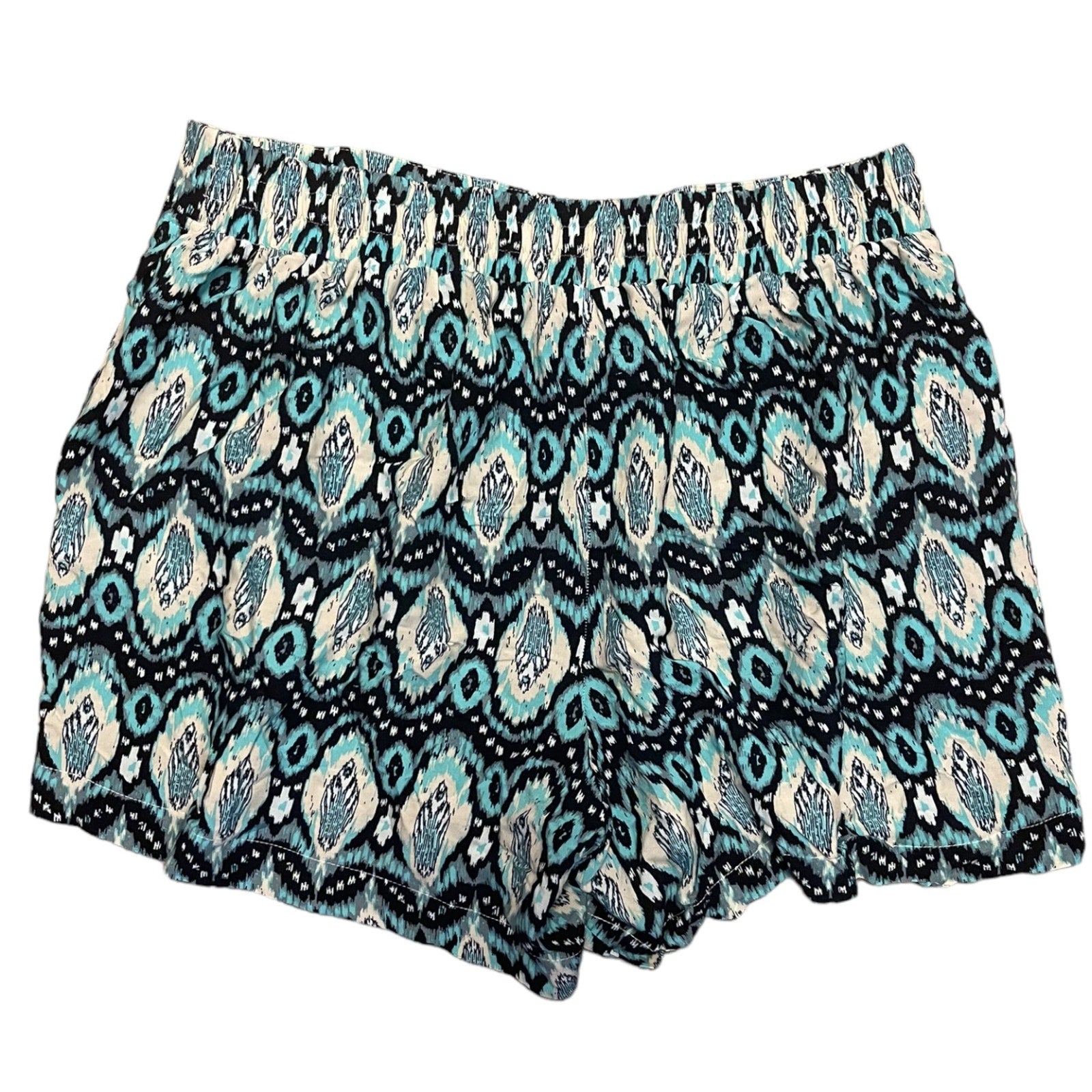 A pair of women's shorts featuring an all-over geometric ikat pattern in blue, black, and cream, displayed flat against a solid white background.