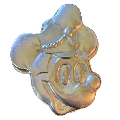 Silver Mickey Mouse shaped like a cartoon character's face cake pan on a white background