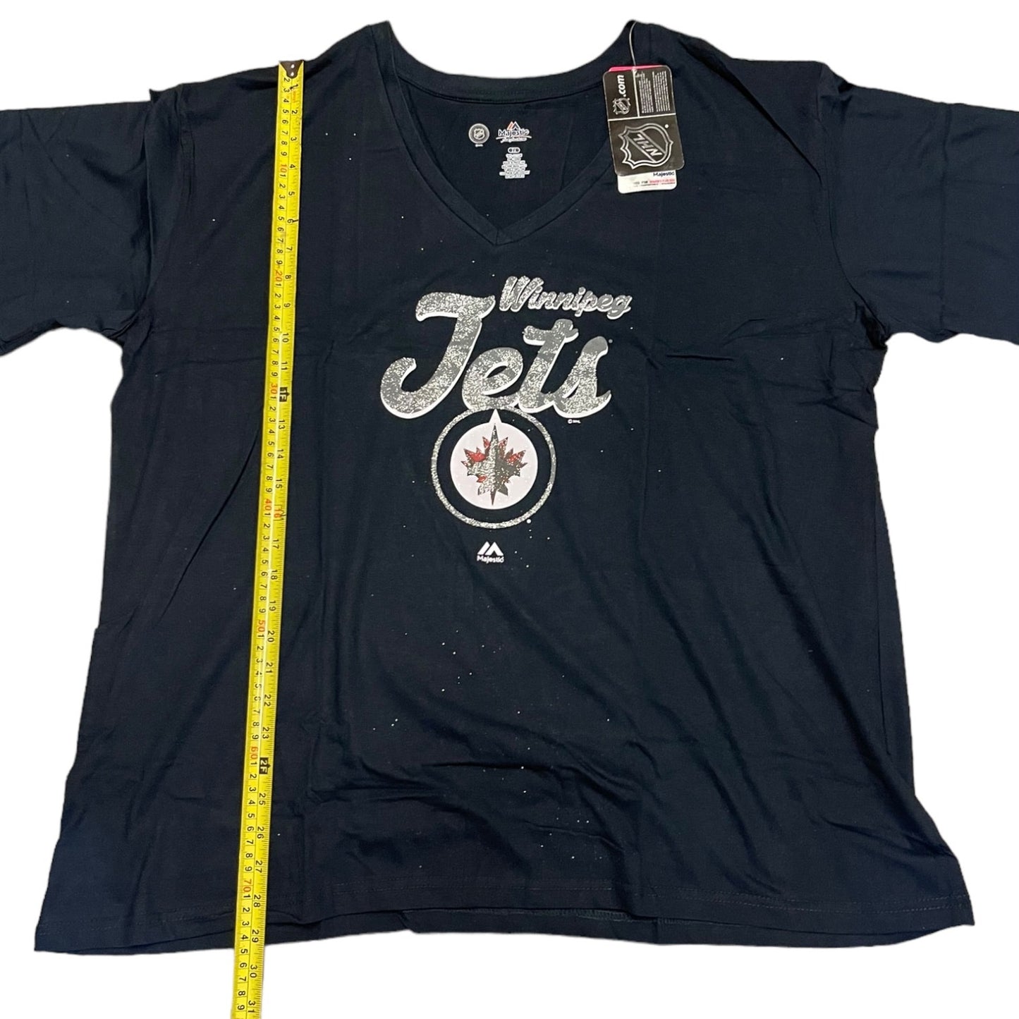 Blue t-shirt with 'Winnipeg Jets' logo and measuring tape on a white background