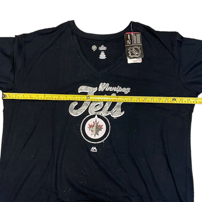Blue t-shirt with 'Winning Jets' text and logo, measured with a tape measure.