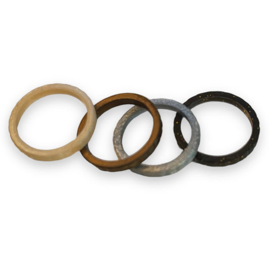 Four rings of different colors on a white background