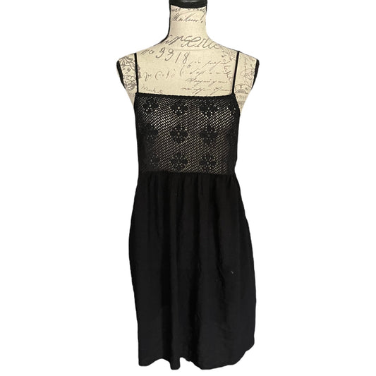 Black cover up front with lace top on a mannequin against a white background