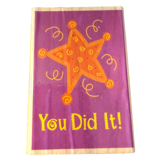 Large star and 'You Did It!' text stamp on a white background