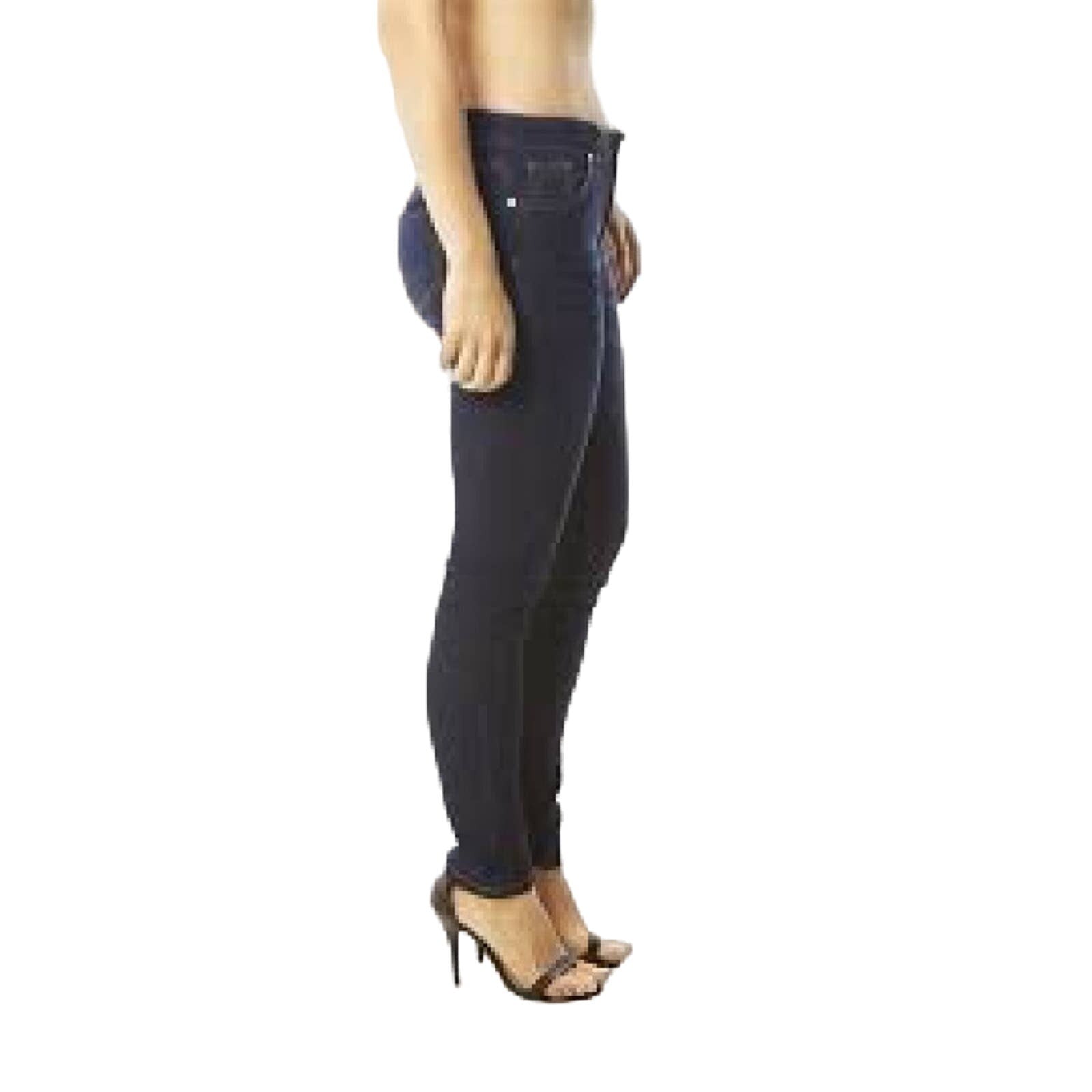 Side of Dark blue jeans worn by a person on a white background