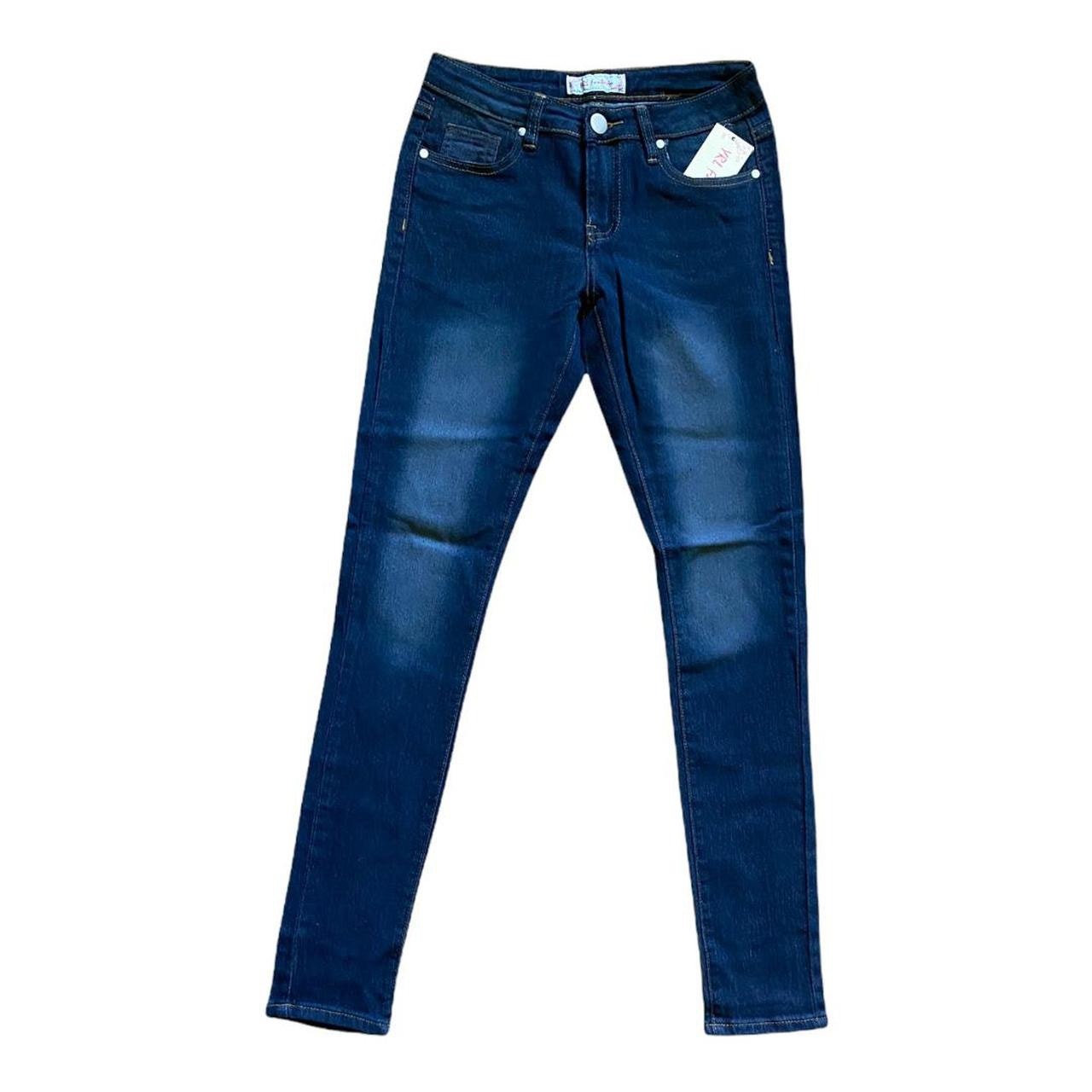 Blue jeans laying out flat on white background