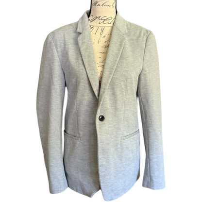 Front of Gray blazer on a mannequin with a white background