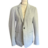 Front of Gray blazer on a mannequin with a white background