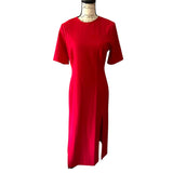 Red dress on a mannequin against a white background