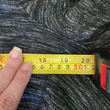 End of measurement of gray sweater