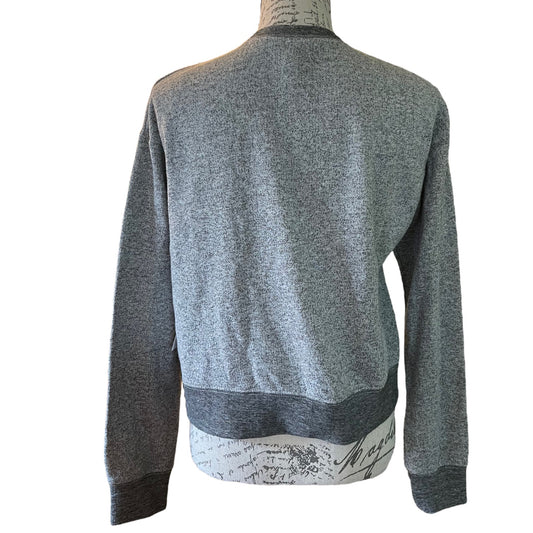 A gray sweatershirt shown from the back on a dress form mannequin against a plain white background.