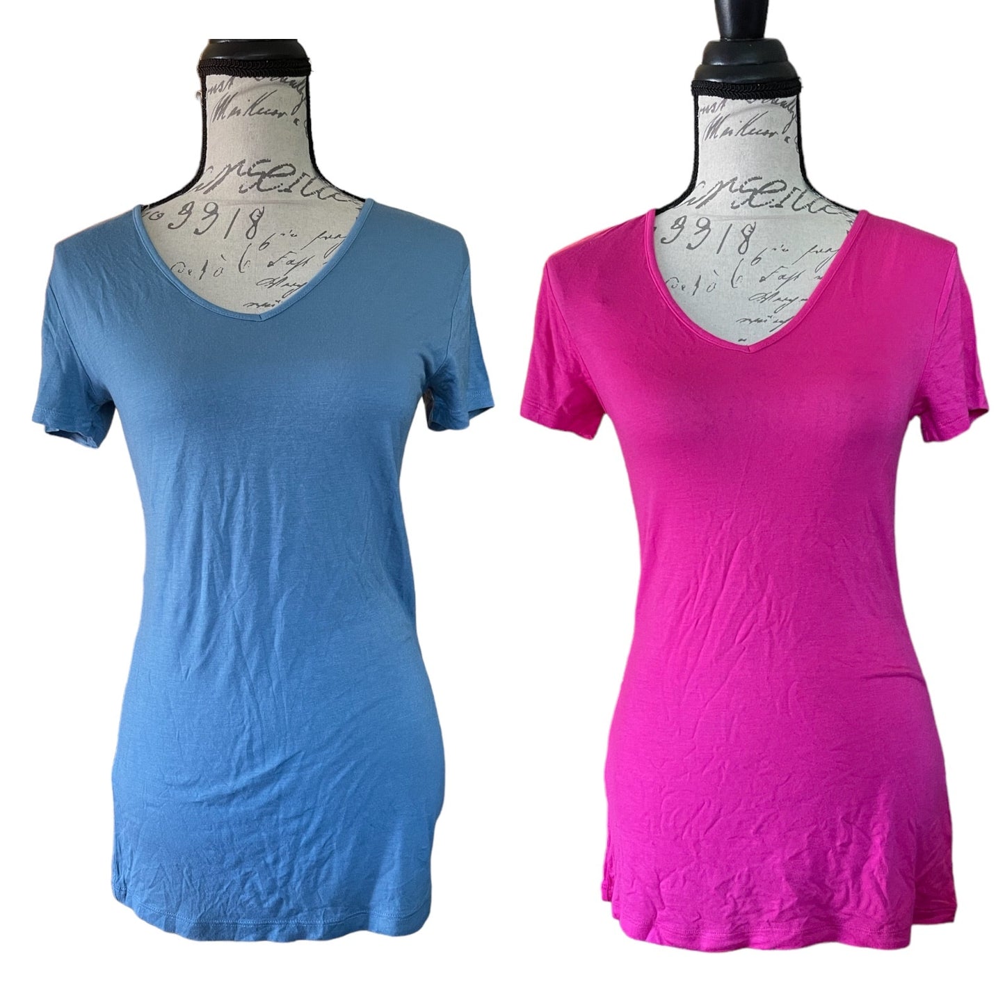Two women's short-sleeve V-neck t-shirts displayed on dress forms against a white background. The shirt on the left is a blue, and the shirt on the right is a bright pink.