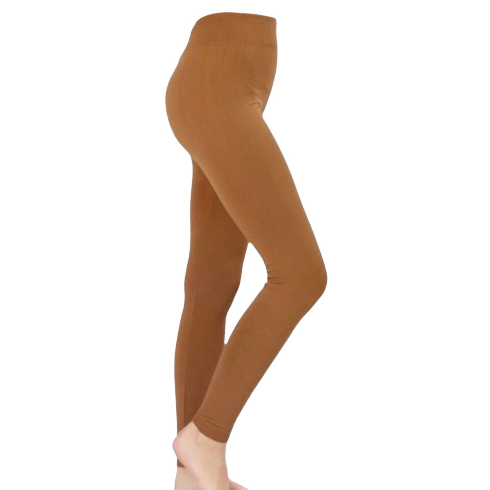 A side profile view of a person wearing gold leggings against a plain white background.