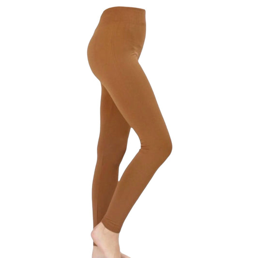 A side profile view of a person wearing gold leggings against a plain white background.