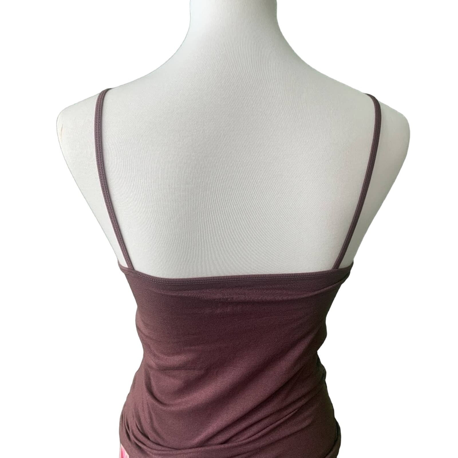Purple tank top on a mannequin with a white background