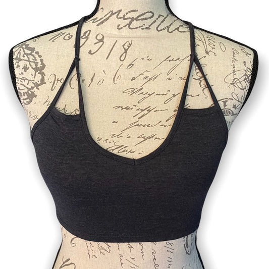Gray crop top on a mannequin with a vintage-style script background