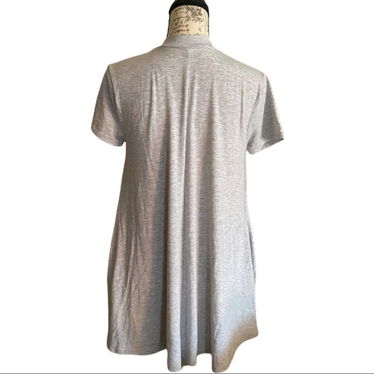 Gray tunic back on a mannequin against a white background