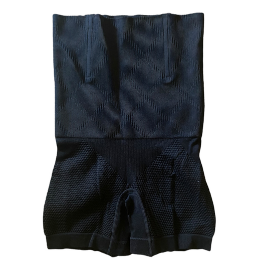 High waisted black shapewear with a textured pattern, featuring a tummy area boning and thigh support.